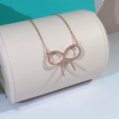 [Renovia Jewelry]CLAW SET RHODIUM PLATED BOW NECKLACE