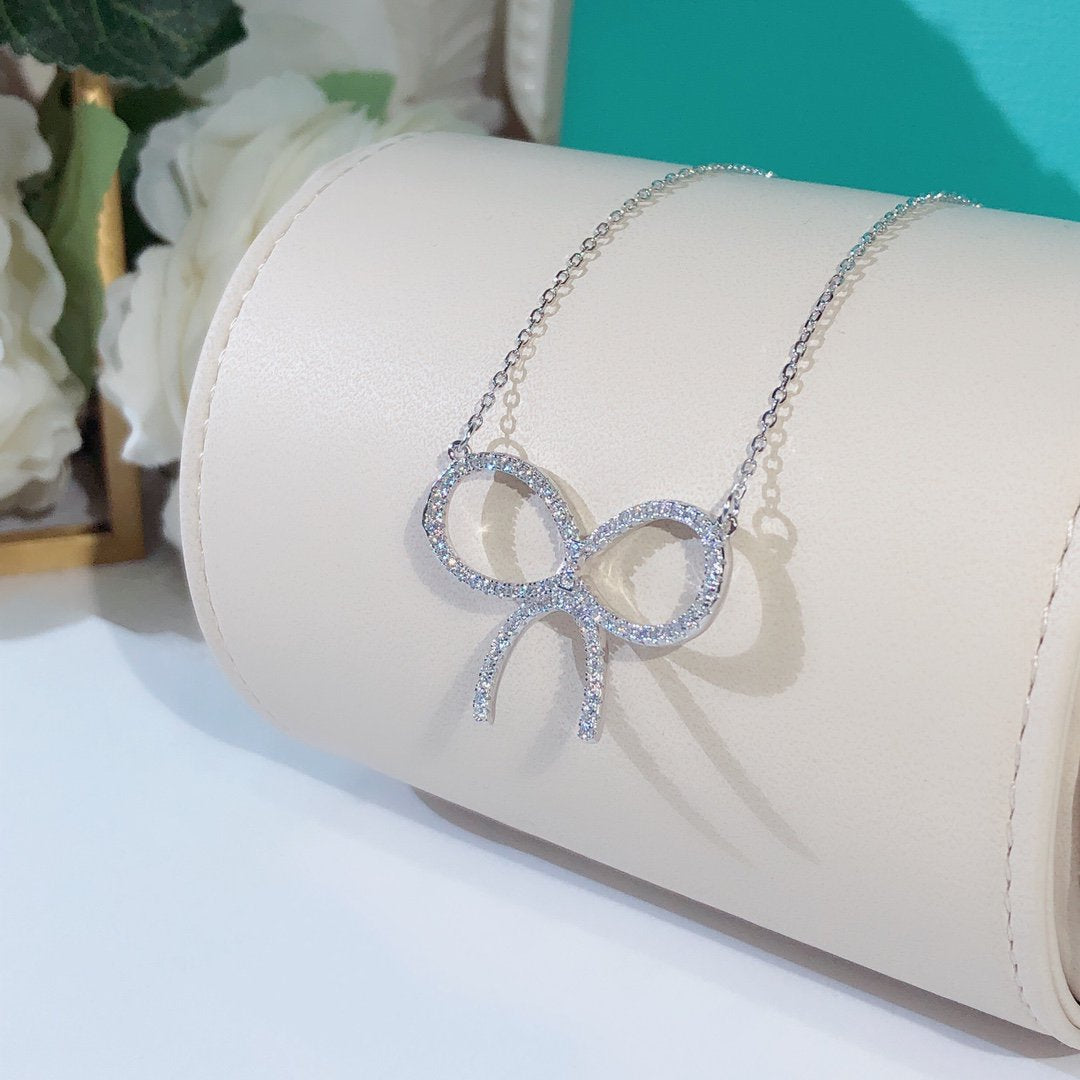 [Renovia Jewelry]CLAW SET RHODIUM PLATED BOW NECKLACE
