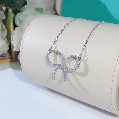 [Renovia Jewelry]CLAW SET RHODIUM PLATED BOW NECKLACE