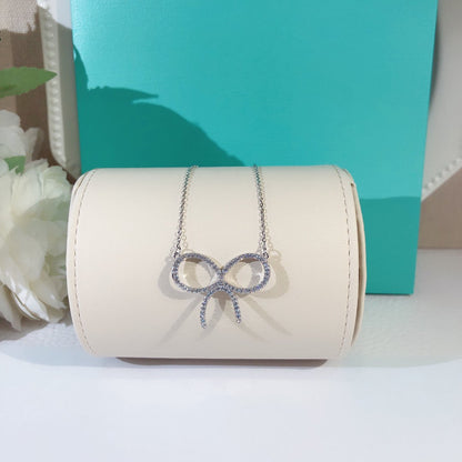 [Renovia Jewelry]CLAW SET RHODIUM PLATED BOW NECKLACE